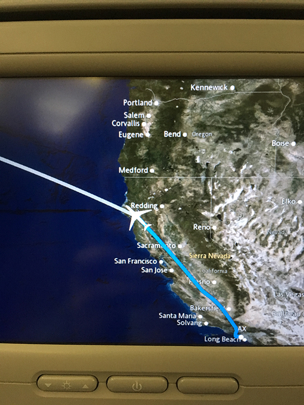 Image of the flight tracker, showing us about to leave California and fly out into open water